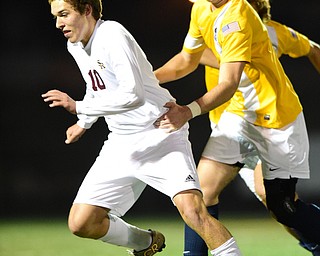 SANDUSKY, OHIO - NOVEMBER 11, 2015: Brandon Youngs #10 of South Range is held from behind by Austin Welch #5 of Archbold during the 1st half of Wednesday nights State Semi-Final game at Cedar Point Stadium. Out Range won 1-0. DAVID DERMER | THE VINDICATOR