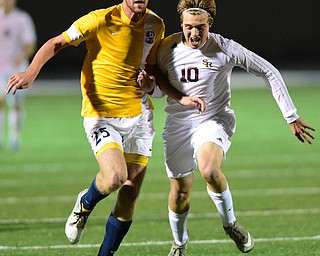SANDUSKY, OHIO - NOVEMBER 11, 2015: Brandon Youngs #10 of South Range and Jack Fisher #25 of Archbold chase after the ball into the corner of the field during the 1st half of Wednesday nights State Semi-Final game at Cedar Point Stadium. Out Range won 1-0. DAVID DERMER | THE VINDICATOR