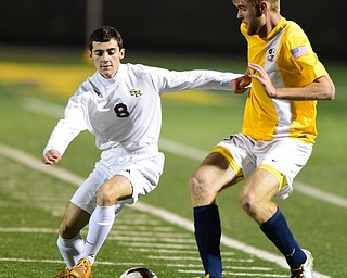 SANDUSKY, OHIO - NOVEMBER 11, 2015: Mathis Russo #8 of South Range pressures Jack Fisher #25 of Archbold during the 2nd half of Wednesday nights State Semi-Final game at Cedar Point Stadium. Out Range won 1-0. DAVID DERMER | THE VINDICATOR