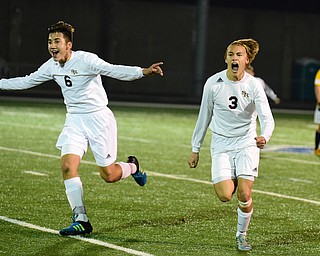 SANDUSKY, OHIO - NOVEMBER 11, 2015: Landon Baer #6 and Cole Frank #3 of South Range run off the field in celebration after time expired during Wednesday nights State Semi-Final game at Cedar Point Stadium. Out Range won 1-0. DAVID DERMER | THE VINDICATOR