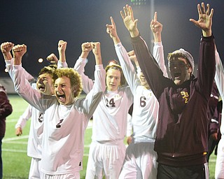 SANDUSKY, OHIO - NOVEMBER 11, 2015: Brooks Thomas #, Scott Erb #21, Cole Frank #3, Zach Schick #24 and Landon Baer #6 of South Range celebrate with the fans in the stands after time expired during Wednesday nights State Semi-Final game at Cedar Point Stadium. Out Range won 1-0. DAVID DERMER | THE VINDICATOR