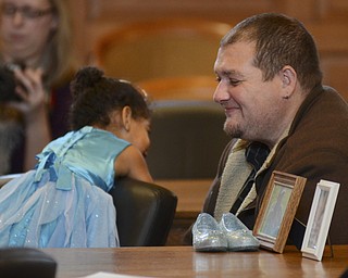 Katie Rickman | The Vindicator.William Anderson smiles at his newly adopted daughter Janiyah (OKAY) 2 is legally pronounced an Anderson during adoption proceedings at the Trumbull Country Courthouse during Adoption Month celebrations on Friday, November 13, 2015.