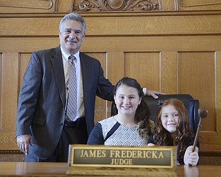 Katie Rickman | The Vindicator.Judge James Fredericka smiles as he poses for photos with Desi Allen 12 and her newly adopted sister Vada 8 after adoption proceedings at the Trumbull Country Courthouse during Adoption Month celebrations on Friday, November 13, 2015.