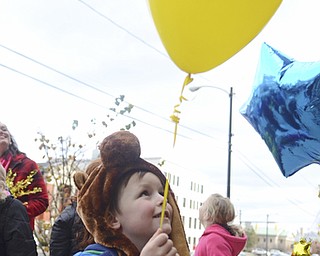 Katie Rickman | The Vindicator.Christopher Markovich holds a balloon during a balloon launch after adoption proceedings at the Trumbull Country Courthouse during Adoption Month celebrations on Friday, November 13, 2015.