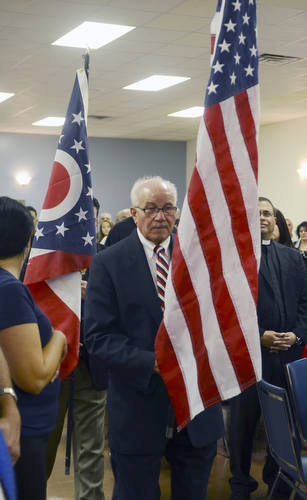 Katie Rickman | The Vindicator.Victor Reyes (front) and Jaime Garayua present the flags during the opening ceremony of the 11th Annual Hispanic Veteran's Appreciation Dinner Saturday night.