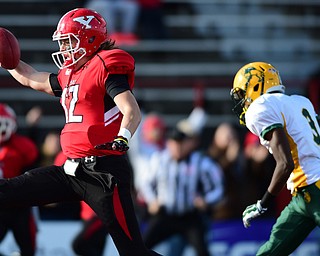 YOUNGSTOWN, OHIO - NOVEMBER 14, 2015: Ricky Davis #12 of YSU high steps into the end zone to score a YSU touchdown after sprinting past Tre Dempsey #3 of North Dakota State during the 1st half of their game at Stambaugh Stadium Saturday afternoon. DAVID DERMER | THE VINDICATOR