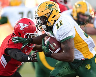 YOUNGSTOWN, OHIO - NOVEMBER 14, 2015: King Frazier #22 of North Dakota State runs into the end zone to score a touchdown breaking the arm tackle from LeRoy Alexander #3 of YSU during the 2nd half of their game at Stambaugh Stadium Saturday afternoon. DAVID DERMER | THE VINDICATOR