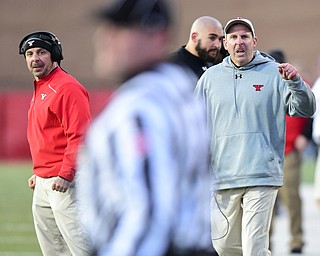 YOUNGSTOWN, OHIO - NOVEMBER 14, 2015: Bo Pelili (right) and Carl Pelini (left) glare at the field Judge Steve Gfell after a pass interference call on 4th down gave North Dakota State a 1st down during the 4th quarter of their game at Stambaugh Stadium Saturday afternoon. DAVID DERMER | THE VINDICATOR