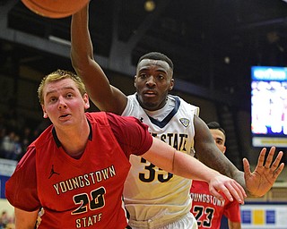 KENT, OHIO - NOVEMBER 14, 2015: Bobby Hain #20 of YSU prevents Jimmy Hall #35 of Kent State from keeping the ball from going out of bounds giving YSU possession during the 2nd half of Saturday nights game at the Memorial Athletic and Convocation Center. Kent State won 79-70. DAVID DERMER | THE VINDICATOR