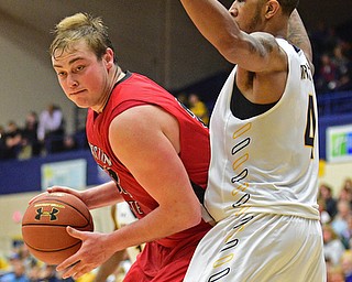 KENT, OHIO - NOVEMBER 14, 2015: Joren Kaufman #32 of YSU attempts to go to the basket while being tightly guarded by Chris Ortiz #4 of Kent State during the 2nd half of Saturday nights game at the Memorial Athletic and Convocation Center. Kent State won 79-70. DAVID DERMER | THE VINDICATOR