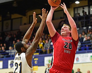 KENT, OHIO - NOVEMBER 14, 2015: Bobby Hain #20 of YSU puts up a shot over Khaliq Spicer #21 of Kent State during the 2nd half of Saturday nights game at the Memorial Athletic and Convocation Center. Kent State won 79-70. DAVID DERMER | THE VINDICATOR
