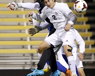 Canfield South Range's Mark Vennetti, right, heads the ball against Cincinnati Summit Country Day's Josh Campbell  during the first half of the boys Division III Ohio State Soccer Championship Saturday, Nov. 14, 2015, in Columbus, Ohio. (Photo/Paul Vernon)
