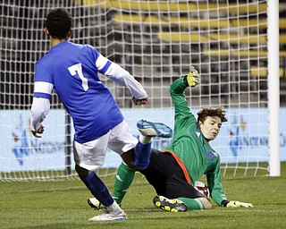 Canfield South Range goalie Brant Rothbauer, right, stops a shot by  Cincinnati Summit Country Day's Cameron Belle during the second half of the boys Division III Ohio State Soccer Championship Saturday, Nov. 14, 2015, in Columbus, Ohio. Cincinnati Summit Country Day won 9-0. (Photo/Paul Vernon)