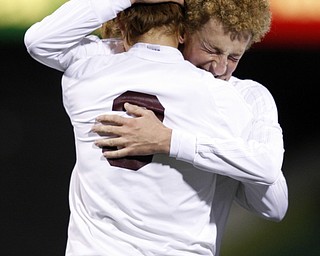 Canfield South Range's Brooks Thomas, right, hugs teammate Cole Frank as they  react following a 9-0 boys Division III Ohio State Soccer Championship loss to Cincinnati Summit Country Day Saturday, Nov. 14, 2015, in Columbus, Ohio. (Photo/Paul Vernon)