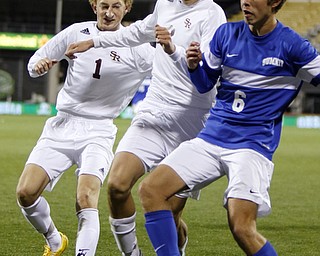 Canfield South Range's Brooks Thomas (1), left, and teammate Cole Frank (3) work for the ball against Cincinnati Summit Country Day's Jacob Beardslee (6) during the second half of the boys Division III Ohio State Soccer Championship Saturday, Nov. 14, 2015, in Columbus, Ohio. Cincinnati Summit Country Day won 9-0. (Photo/Paul Vernon)