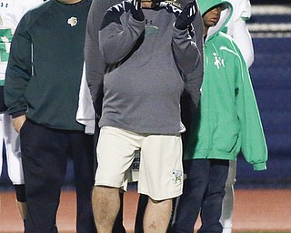 Ursuline head coach Larry Kempe watches from the sideline during their playoff game against Woodridge at Hudson High School in Hudson, Ohio, Nov. 14, 2015. Alex Slitz for The Vindicator