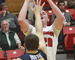 William D Lewis the VindicatorYSU's Bobby Haim(20) shootsover Toledo's NAthan Boothe during 11-18-15 action at YSU.