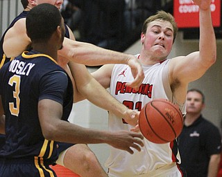 William D Lewis the VindicatorYSU's Jorden Kaufman(32) battles for a rebound with toledo's Nathan Boone(33) and Stuckey Mosley(3)  during 11-18-15 action at YSU.