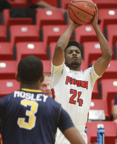 William d Lewis The Vindicator YSU Cameron Morse(24)  shoots over Toledo's Stuckey Mosley during 11182015 action at YSU.