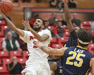 William D Lewis the Vindicator YSU's Franciscosantiago (23) shoots past Toledo's Jordan Lauf(25) during 11182015 game.