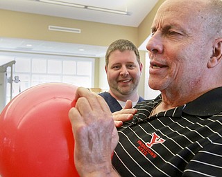 William D. Lewis The Vindicator Rev. Steve Popovich gets physical therapy from Tery O'Neill at Liberty Healthcare and Rehab. Popovich was paralized in a car crash.