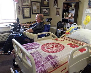 William D. Lewis The Vindicator Rev. Steve Popovich  in his room at Liberty Healthcare and Rehab. Popovich was paralized in a car crash and residing and undergoing therapy at the Liberty facility .
