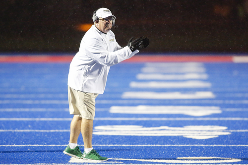Ursuline head coach Larry Kempe instructs the team during the Division IV regional final against Crestwood at Ravenna High School, in Ravenna Ohio, Nov. 21, 2015. Alex Slitz for The Vindicator