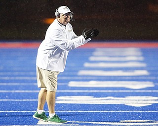 Ursuline head coach Larry Kempe instructs the team during the Division IV regional final against Crestwood at Ravenna High School, in Ravenna Ohio, Nov. 21, 2015. Alex Slitz for The Vindicator