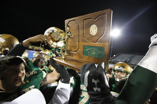 Members of the Ursuline football team celebrate after defeating Crestwood in the Division IV regional final at Ravenna High School, in Ravenna Ohio, Nov. 21, 2015. Alex Slitz for The Vindicator