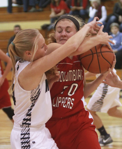 William D Lewis The Vindicator  McDonald's Brenna rupe(14), left, qnd Columbiana's Alexis Cross(20) fight for  a rebound during 11-3--15 action at McDonald.