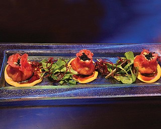 An appetizer from the sushi bar at Fushimi Japanese Restaurant. The Tuna Dumpling ($9.95) consists of mashed avocado and crab wrapped in tuna and topped with caviar. Dumplings are cleverly designed to look like flowers.