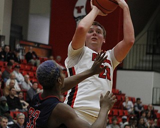 Youngstown State's Bobby Hain (20) puts up a shot while being defended by Andre Frederick (33) of Robert Morris during the first half of Wednesday nights matchup at the Beeghly Center.  Dustin Livesay  |  The Vindicator  12/2/15  Beeghly Center