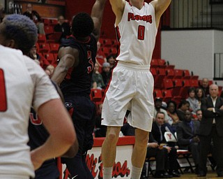 Youngstown State's Matt Donlan (0) attempts a 3-pointer while being defended by Kavon Stewart (3) of Robert Morris during the first half of Wednesday nights matchup at the Beeghly Center. Dustin Livesay | The Vindicator 12/2/15 Beeghly Center