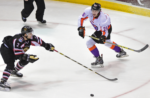 YOUNGSTOWN, OHIO _ DECEMBER 2, 2015: Cameron Morrison #26 of the Phantoms passes the puck while being pressured by Mitch Eliot #2 of the Lumberjacks during the 1st period of their game Wednesday morning at the Covelli Center. The Phantoms won 6-5 in OT. DAVID DERMER | THE VINDICATOR