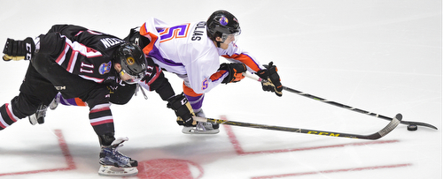 YOUNGSTOWN, OHIO _ DECEMBER 2, 2015: Vas Kolas #5 of the Phantoms skates with the puck ahead of Trevor Hamilton #11 of the Lumberjacks during the 2nd period of their game Wednesday morning at the Covelli Center. The Phantoms won 6-5 in OT. DAVID DERMER | THE VINDICATOR