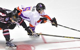 YOUNGSTOWN, OHIO _ DECEMBER 2, 2015: Vas Kolas #5 of the Phantoms skates with the puck ahead of Trevor Hamilton #11 of the Lumberjacks during the 2nd period of their game Wednesday morning at the Covelli Center. The Phantoms won 6-5 in OT. DAVID DERMER | THE VINDICATOR