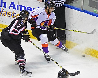 YOUNGSTOWN, OHIO _ DECEMBER 2, 2015: Luke McInnis #3 of the Phantoms plays the puck in the corner before being checked by Mitch Eliot #2 of the Lumberjacks during the 2nd period of their game Wednesday morning at the Covelli Center. The Phantoms won 6-5 in OT. DAVID DERMER | THE VINDICATOR