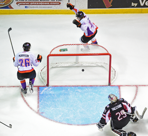 YOUNGSTOWN, OHIO _ DECEMBER 2, 2015: Chase Pearson #22 of the Phantoms celebrates behind the net with teammate Cameron Morrison #26 after scoring a goal on Joey Accord #29 of the Lumberjacks during the 3rd period of their game Wednesday morning at the Covelli Center. The Phantoms won 6-5 in OT. DAVID DERMER | THE VINDICATOR