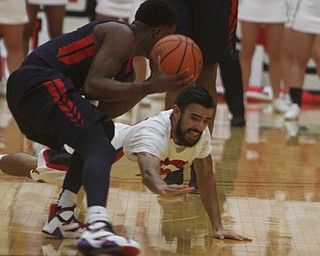 Youngstown State's Francisco Santiago (23) dives after a loose ball from Robert Morris's Kavon Stewart (3) during the first half of Wednesday nights matchup at the Beeghly Center.  Dustin Livesay  |  The Vindicator  12/2/15  Beeghly Center