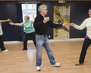 Katie Rickman | The Vindicator.Kathy Durrell, a Youngstown State fencing instructor, on far right front, works on foot work with Eric Newton of Austintown as Leta Sims of Austintown (back left) andSusan McFarland also practice during a fencing class at Austintown Senior Center on Thursday, November 12, 2015.
