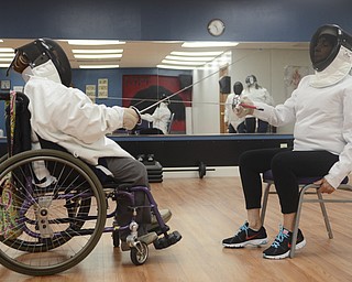 Katie Rickman | The Vindicator.Mary  Hanick of Austintown, on left, and Barb Sylvester also of Austintown participate in a fencing class at Austintown Senior Center on Thursday, November 12, 2015.