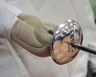 Katie Rickman | The Vindicator.A woman holds a sword as she suits up during a fencing class at Austintown Senior Center on Thursday, November 12, 2015.