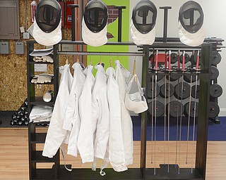 Katie Rickman | The Vindicator.Fencing gear sits off to the side as participants work on foot work during a fencing class at Austintown Senior Center on Thursday, November 12, 2015.