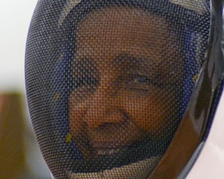 Katie Rickman | The Vindicator.Leta Sims smiles as she pauses between fencing excercises at a fencing class at Austintown Senior Center on Thursday, November 12, 2015.