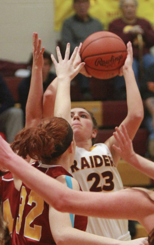 William D. Lewis The Vindicator  SR's Taylor Naples(23) shoots over Mooney's Maggie Monahan(32) during 12-3-15 action at SR.