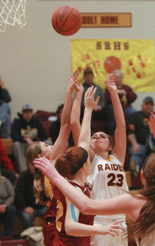 William D. Lewis The Vindicator  SR's Taylor Naples(23) shoots over Mooney's Maggie Monahan(32) during 12-3-15 action at SR.