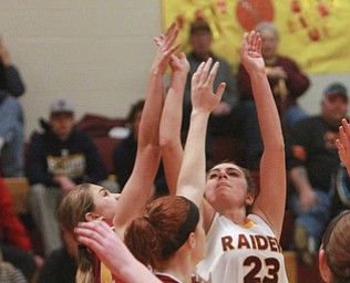 William D. Lewis The Vindicator  SR's Taylor Naples(23) shoots over Mooney's Maggie Monahan(32) during 12-3-15 action at SR.