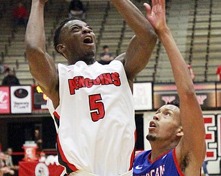 William d Lewis The Vindicator YSU's Sydney Umude(7) shoots around  American's Delante Jones(2) during 12-4-15 action at YSU.
