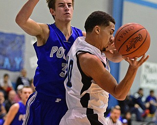 YOUNGSTOWN, OHIO - DECEMBER 4, 2015: Moises Dumeng #30 of East grabs a rebound while being bumped by Mike Gajdos #3 of Poland during the 2nd half of their game Friday night at East High School. DAVID DERMER | THE VINDICATOR