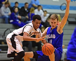 YOUNGSTOWN, OHIO - DECEMBER 4, 2015: Ceandre Backus #5 of East collides with Matt Baker #11 of Poland while he gains possession of the basketball during the 2nd half of their game Friday night at East High School. DAVID DERMER | THE VINDICATOR